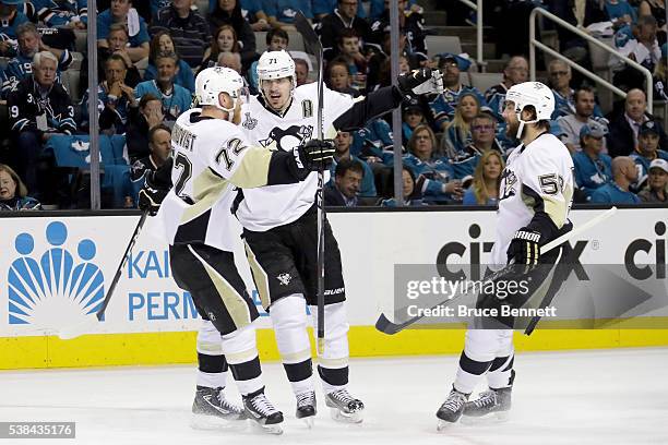 Evgeni Malkin of the Pittsburgh Penguins celebrates with Patric Hornqvist and Kris Letang after scoring against the San Jose Sharks in the second...