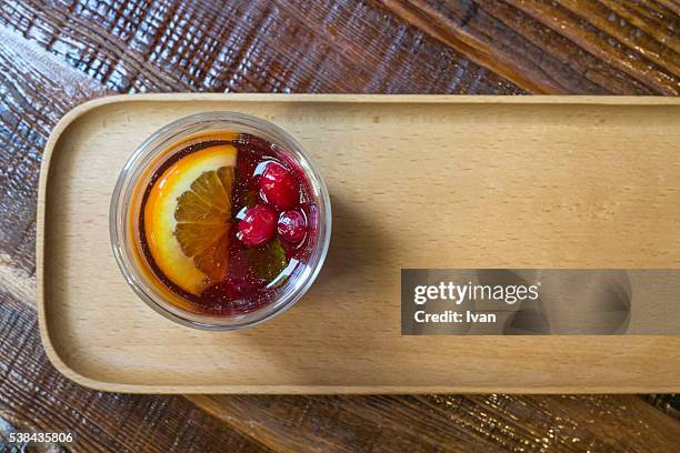 ice cold glass of raspberry iced tea over ice cubes - whiskey sour stock pictures, royalty-free photos & images