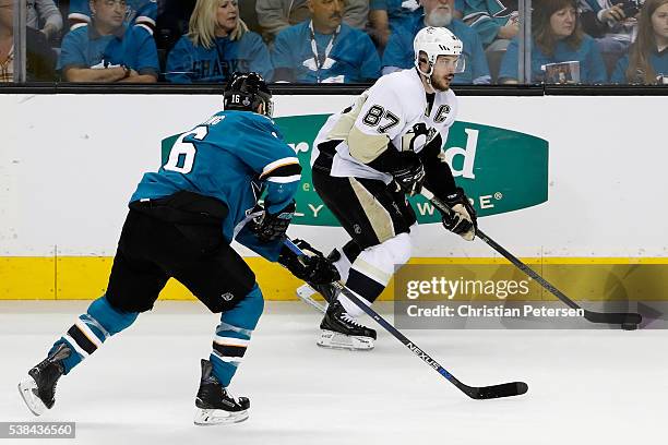 Sidney Crosby of the Pittsburgh Penguins skates against Nick Spaling of the San Jose Sharks during the first period in Game Four of the 2016 NHL...