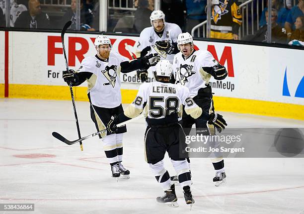 Evgeni Malkin of the Pittsburgh Penguins celebrates his second period goal with Patric Hornqvist, Kris Letang andSidney Crosby during Game Four of...