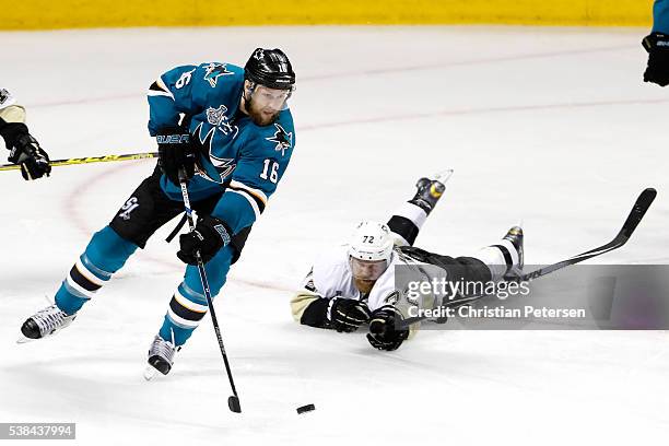 Nick Spaling of the San Jose Sharks controls the puck against Patric Hornqvist of the Pittsburgh Penguins in Game Four of the 2016 NHL Stanley Cup...