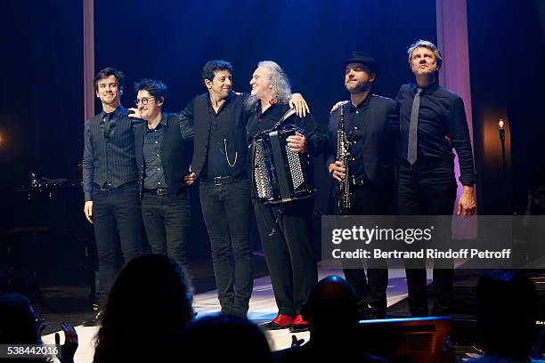 Singer Patrick Bruel, musician Roland Romanelli and others musicians acknowledge the applause of the audience at the end of the Concert of Patrick...