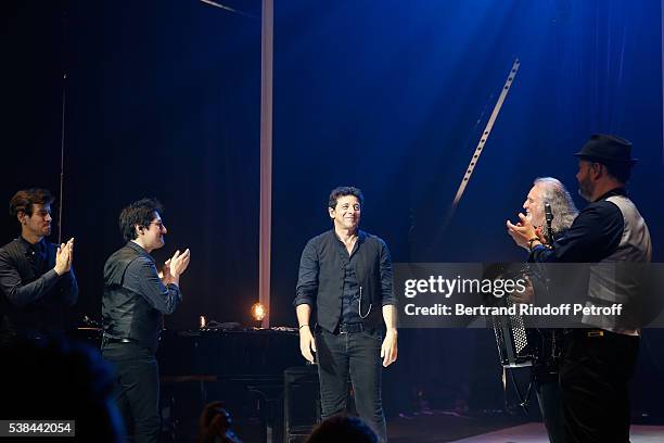 Singer Patrick Bruel, musician Roland Romanelli and others musicians acknowledge the applause of the audience at the end of the Concert of Patrick...