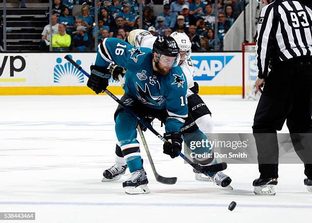 Nick Spaling of the San Jose Sharks holds off Sidney Crosby of the Pittsburgh Penguins in Game Four of the 2016 NHL Stanley Cup Final at the SAP...