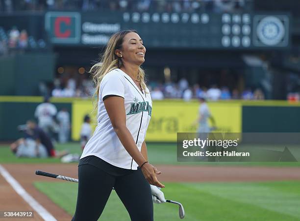 Player Cheyenne Woods reacts to a shot at home plate on the field at Safeco Field prior to the start of the KPMG Women's PGA Championship at the...