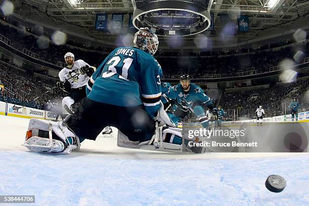 Martin Jones of the San Jose Sharks allows a goal to Eric Fehr of the Pittsburgh Penguins in the third period of Game Four of the 2016 NHL Stanley...