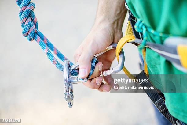 rock climbing preparation - safety harness stock pictures, royalty-free photos & images