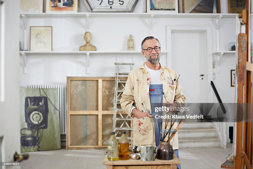 Portrait of mature man in his home art studio