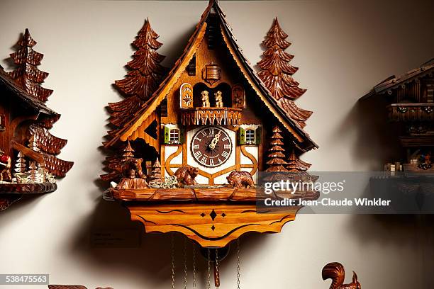 german cuckoo clock traditionally made in triberg - cuckoo clock stock pictures, royalty-free photos & images