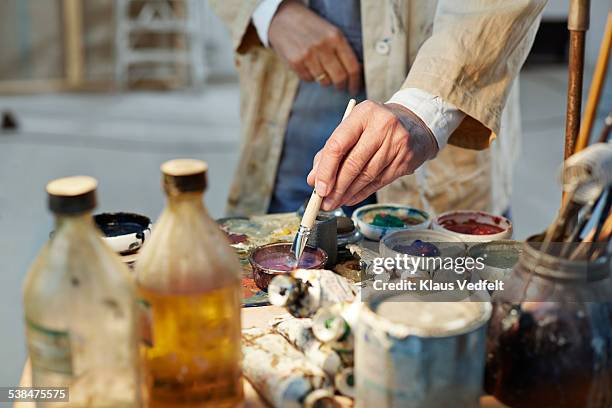 senior man getting mixing colors before painting - painters hands stock pictures, royalty-free photos & images
