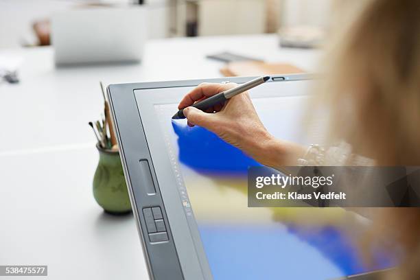 mature graphic designer working on monitor - digitized pen stock-fotos und bilder