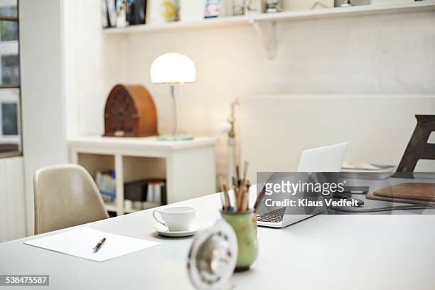 still-life of desk at small creative office - desk stock pictures, royalty-free photos & images