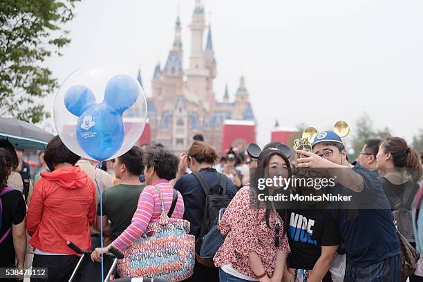shanghai disneyland selfie - chinese dolls stock pictures, royalty-free photos & images