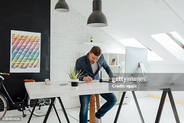 graphic designer at work. - illustrator stock pictures, royalty-free photos & images