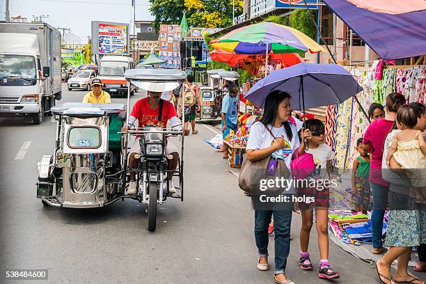 street in batangas, philippines - passenger tricycle bildbanksfoton och bilder