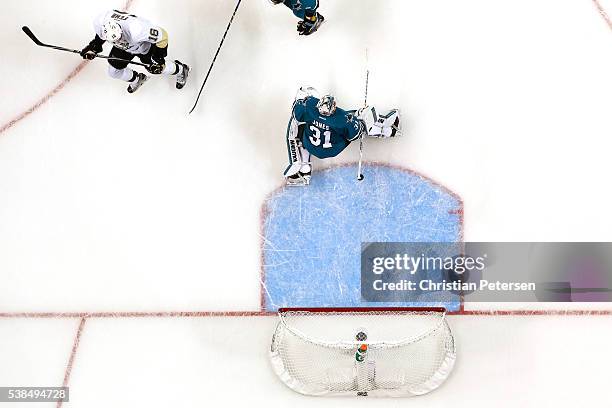 Martin Jones of the San Jose Sharks allows a goal to Eric Fehr of the Pittsburgh Penguins in the third period of Game Four of the 2016 NHL Stanley...