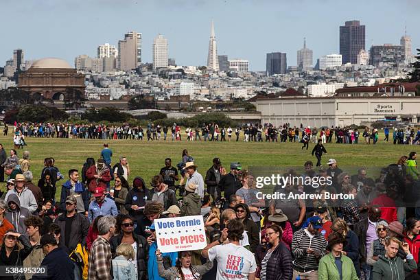 People wait in line to attend a rally held by Democratic presidential candidate Senator Bernie Sanders at the Presidio on June 6, 2016 in San...