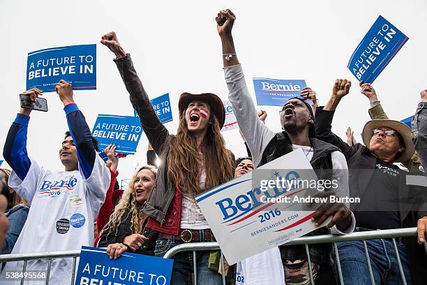 Audience members at a rally held by Democratic presidential candidate Senator Bernie Sanders at the Presidio cheer while waiting for Sanders to...