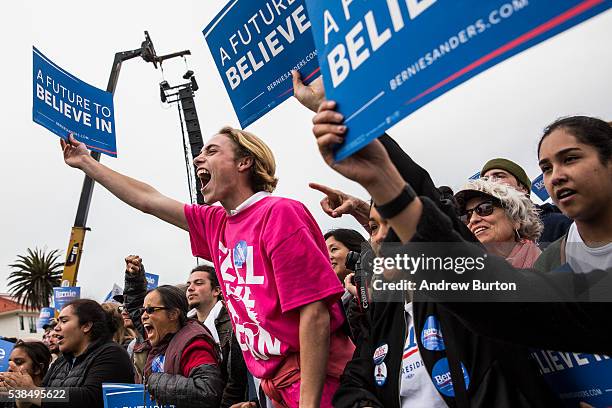 Audience members at a rally held by Democratic presidential candidate Senator Bernie Sanders at the Presidio cheer while waiting for Sanders to...