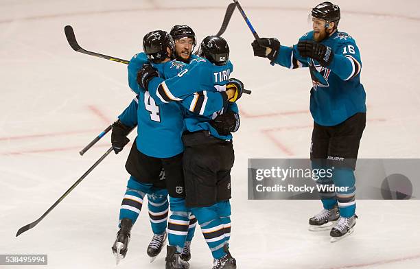 Chris Tierney, Nick Spaling, Brenden Dillon and Melker Karlsson of the San Jose Sharks celebrate Karlsson's goal during the third period of Game Four...