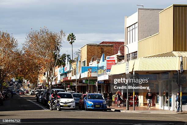 Cars stand at a traffic stop in the western suburb of Penrith in Sydney, Australia, on Monday, June 6, 2016. An economic divide is almost slicing...