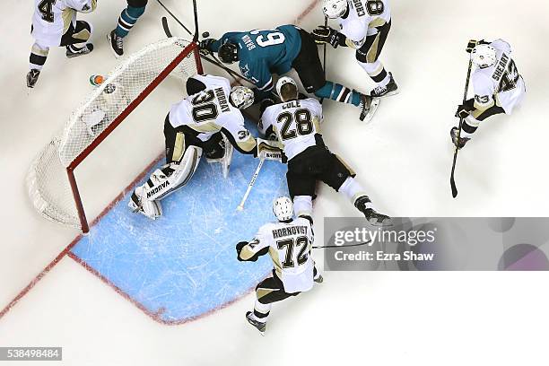 The Pittsburgh Penguins combine to stop Justin Braun of the San Jose Sharks in Game Four of the 2016 NHL Stanley Cup Final at SAP Center on June 6,...