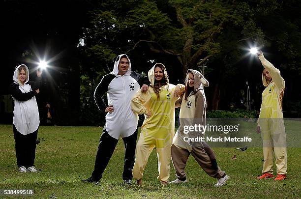 Dayanna Grageda, Miss Earth Australia and other animal lovers pose in animal onesies after participating in a Yoga class at Hyde Park on June 7, 2016...