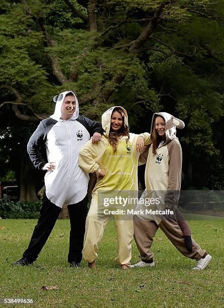 Dayanna Grageda, Miss Earth Australia and other animal lovers pose in animal onesies after participating in a Yoga class at Hyde Park on June 7, 2016...