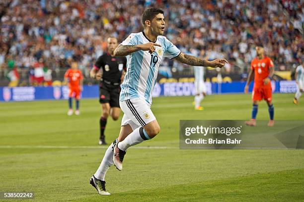 Ever Banega of Argentina celebrates after scoring the second goal against Chile in the second half during a group D match between Argentina and Chile...