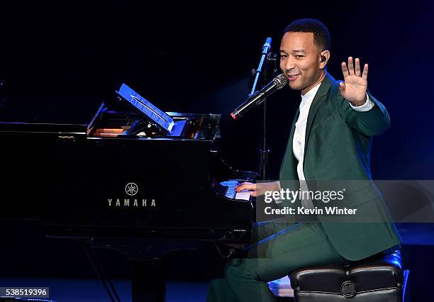 Musician John Legend performs onstage during the "Hillary Clinton: She's With Us" concert at The Greek Theatre on June 6, 2016 in Los Angeles,...