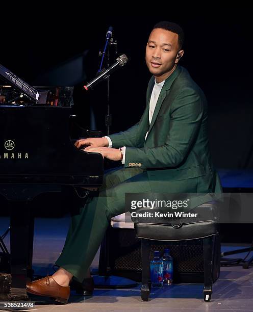 Musician John Legend performs onstage during the "Hillary Clinton: She's With Us" concert at The Greek Theatre on June 6, 2016 in Los Angeles,...