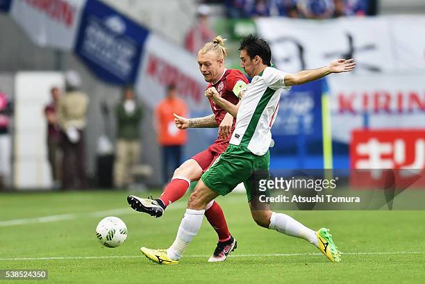 Simon Kjaer of Denmark and Ivelin Popov of Bulgaria compete for the ball during the international friendly match between Denmark and Bulgaria at the...