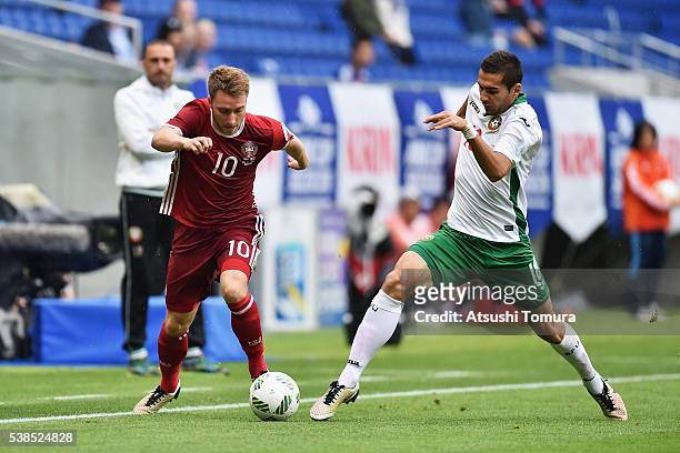 Christian Eriksen of Denmark and Ivaylo Chochev of Bulgaria compete for the ball during the international friendly match between Denmark and Bulgaria...