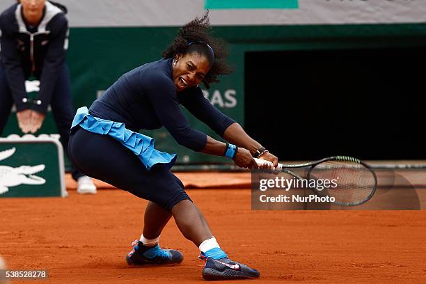 Serena Williams of US serves to Yulia Putintseva of Kazakhstan during the women's single quarter final match at the French Open tennis tournament at...