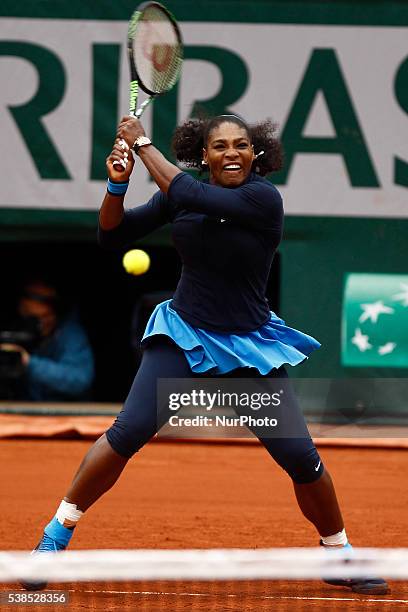 Serena Williams of US serves to Yulia Putintseva of Kazakhstan during the women's single quarter final match at the French Open tennis tournament at...