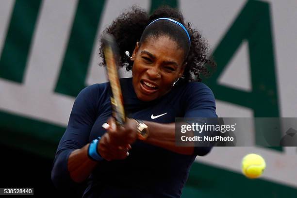 Serena Williams of US serves to Yulia Putintseva of Kazakhstan during the women's single quarter final match at the French Open tennis tournament at...
