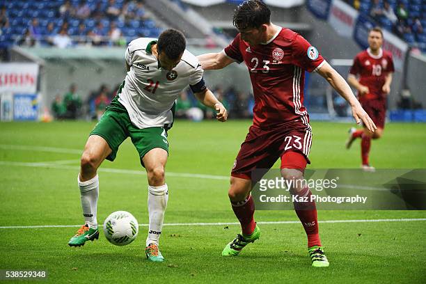 Svetoslav Dyakov of Bulgaria and Pierre-Emile Hojbjerg of Denmark compete for the ball during the international friendly match between Denmark and...