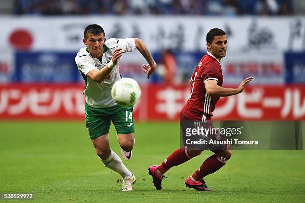 Ventsislav Vasilev of Bulgaria and Riza Durmisi of Denmark compete for the ball during the international friendly match between Denmark and Bulgaria...