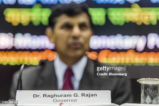 Name card for Raghuram Rajan, governor of the Reserve Bank of India , is displayed on a desk as he speaks during a news conference in Mumbai, India,...