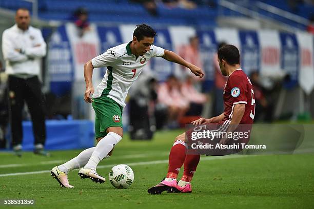 Mihail Alexandrov of Bulgaria and Riza Durmisi of Denmark compete for the ball during the international friendly match between Denmark and Bulgaria...