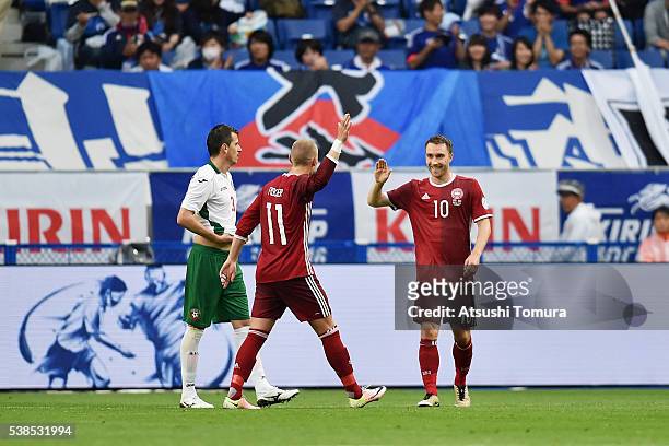 Christian Eriksen of Denmark celebrates scoring his team's third goal with his team mate Viktor Fischer during the international friendly match...