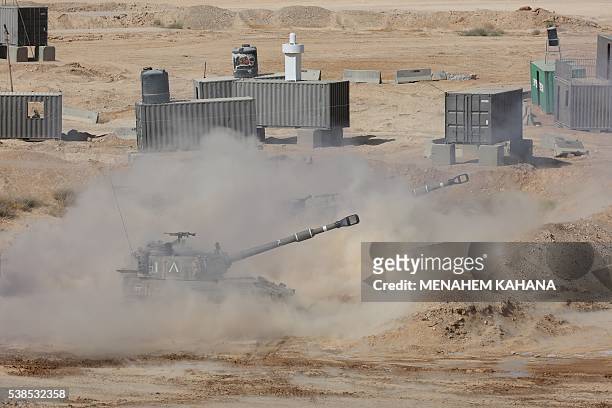 Artillery fire during a joint Israeli army drill which includes infantry, aviation, tanks and artillery units in the army training base of Shizafon...