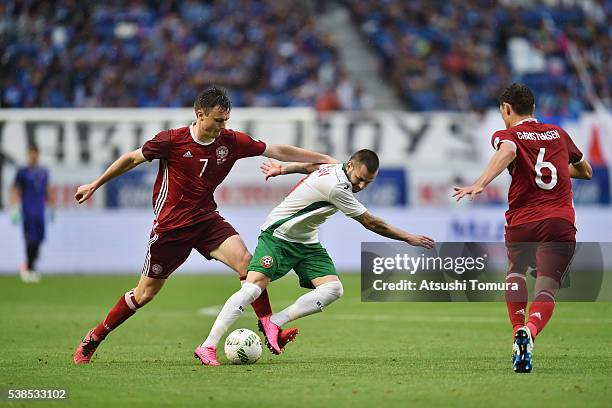 Spas Delev of Bulgaria is challenged by William Kvist and Andreas Christensen of Denmark during the international friendly match between Denmark and...