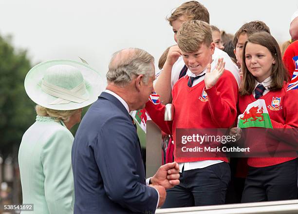 Camilla, Duchess of Cornwall and Prince Charles, Prince of Wales greet school children at the Opening of the Fifth Session of the National Assembly...