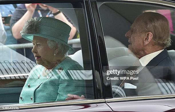 Queen Elizabeth II and Prince Philip, Duke of Edinburgh depart from the Royal Train at Cardiff Central Station ahead of a visit to the city before...