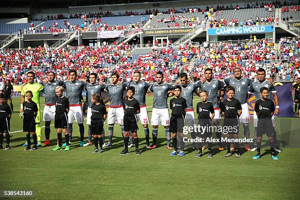 The starting lineup of Paraguay sings their national anthem during the 2016 Copa America Centenario Group A match between Costa Rica and Paraguay at...