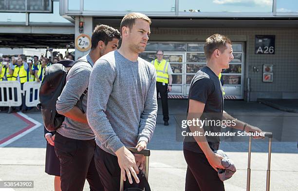 Sami Khedira of Germany, Manuel Neuer of Germany and Toni Kroos of Germany are seen during the German national team departure to France at Frankfurt...