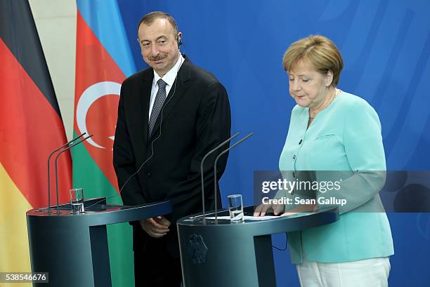 German Chancellor Angela Merkel and Azerbaijani President Ilham Aliyev speak to the media following talks at the Chancellery on June 7, 2016 in...