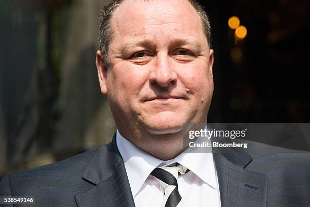 Mike Ashley, billionaire and founder of Sports Direct International Plc, right, arrives to give evidence at a Business, Innovation and Skills...