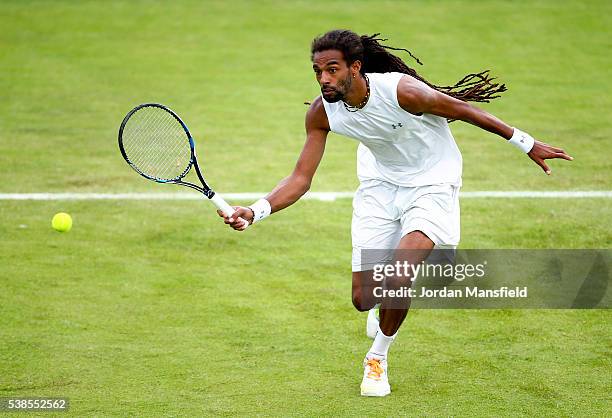 Dustin Brown of Germany plays a forehand during his first round match against Eduardo Struvay of Colombia during day four of the Aegon Surbiton...